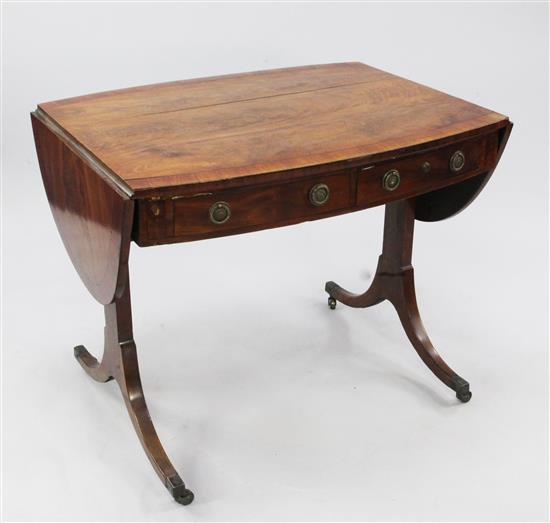 An early 19th century oval crossbanded mahogany sofa table, W.5ft